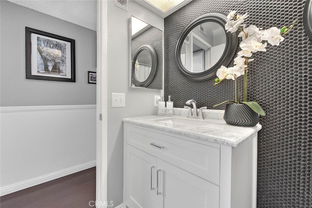 44 Carriage Way, Unit 108 Pomona, CA 91766 - Photo 35 of 44 a bathroom with a sink and a mirror