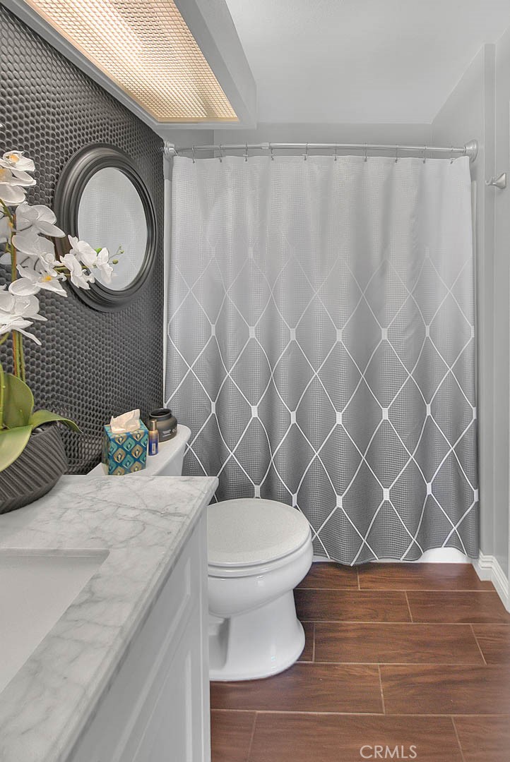 44 Carriage Way, Unit 108 Pomona, CA 91766 - Photo 38 of 44 a bathroom with a sink a toilet and a shower