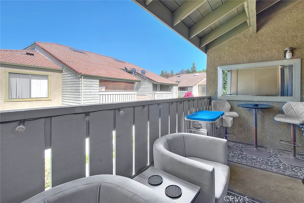 44 Carriage Way, Unit 108 Pomona, CA 91766 - Photo 40 of 44 a view of a chairs and table in the back yard of the house