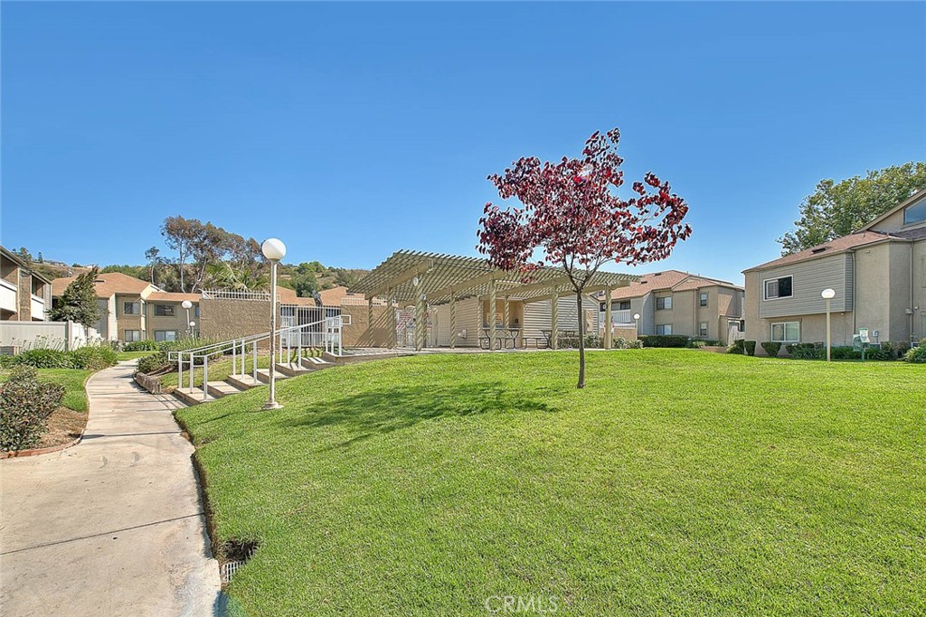 44 Carriage Way, Unit 108 Pomona, CA 91766 - Photo 44 of 44 a house view with a garden space