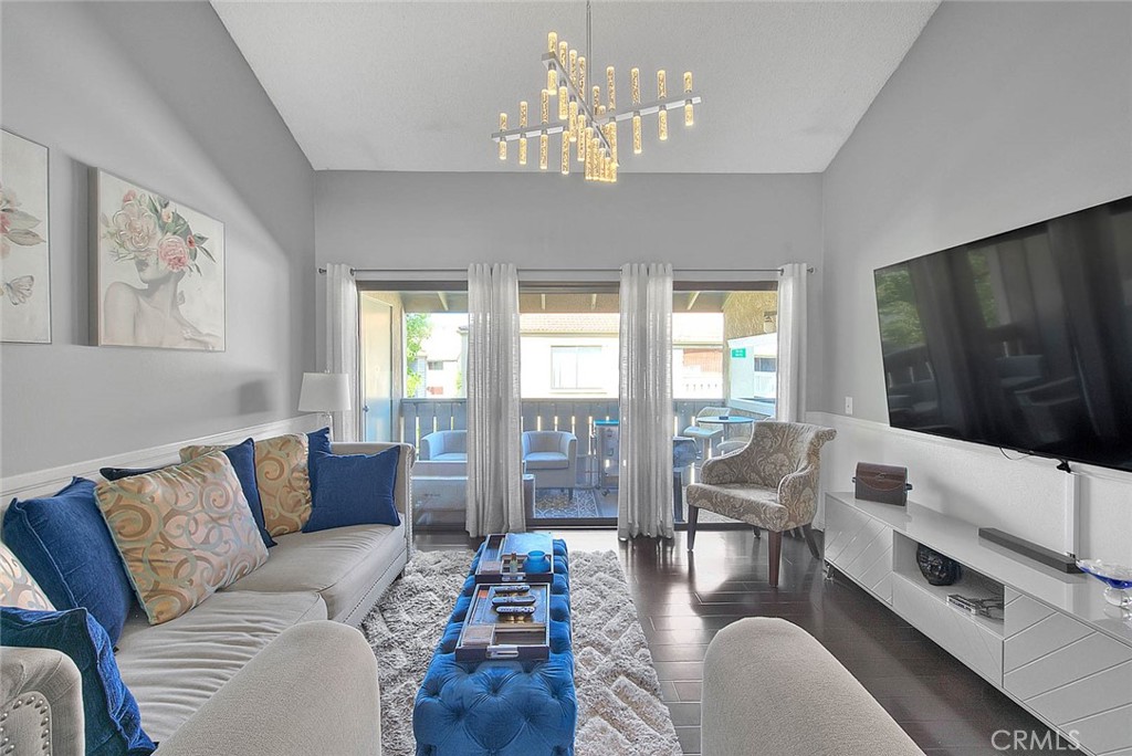 44 Carriage Way, Unit 108 Pomona, CA 91766 - Photo 7 of 44 a living room with furniture flat screen tv and large windows