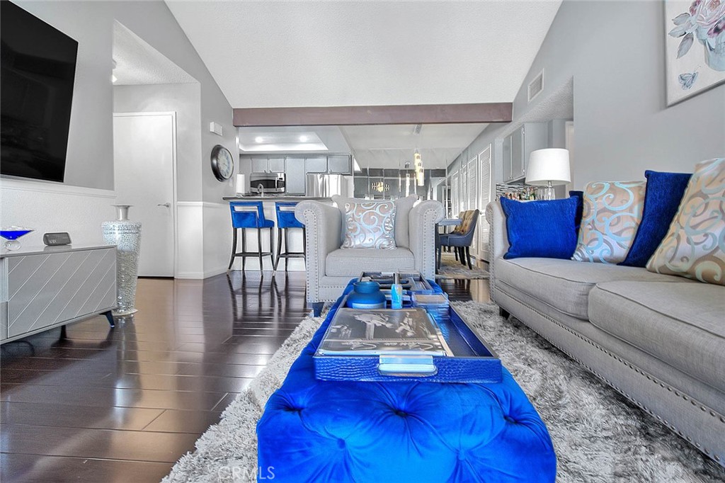 44 Carriage Way, Unit 108 Pomona, CA 91766 - Photo 9 of 44 a living room with furniture and a flat screen tv