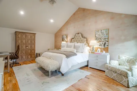 a bed room with a bed and a couch