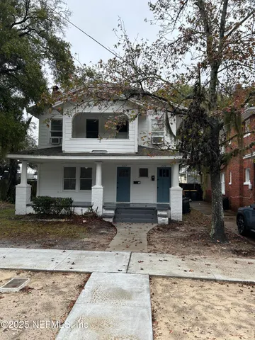 a front view of a house with yard