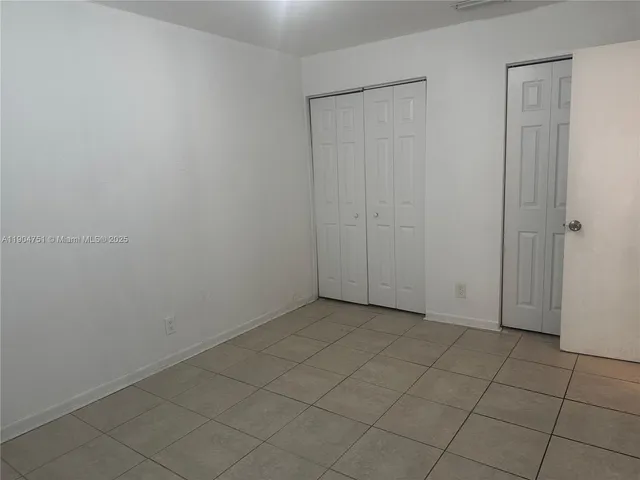 an empty room with a bench