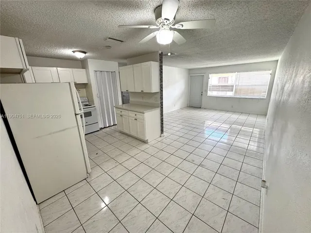 a bathroom with a sink a mirror and a shower