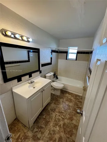 an empty room with a bathroom