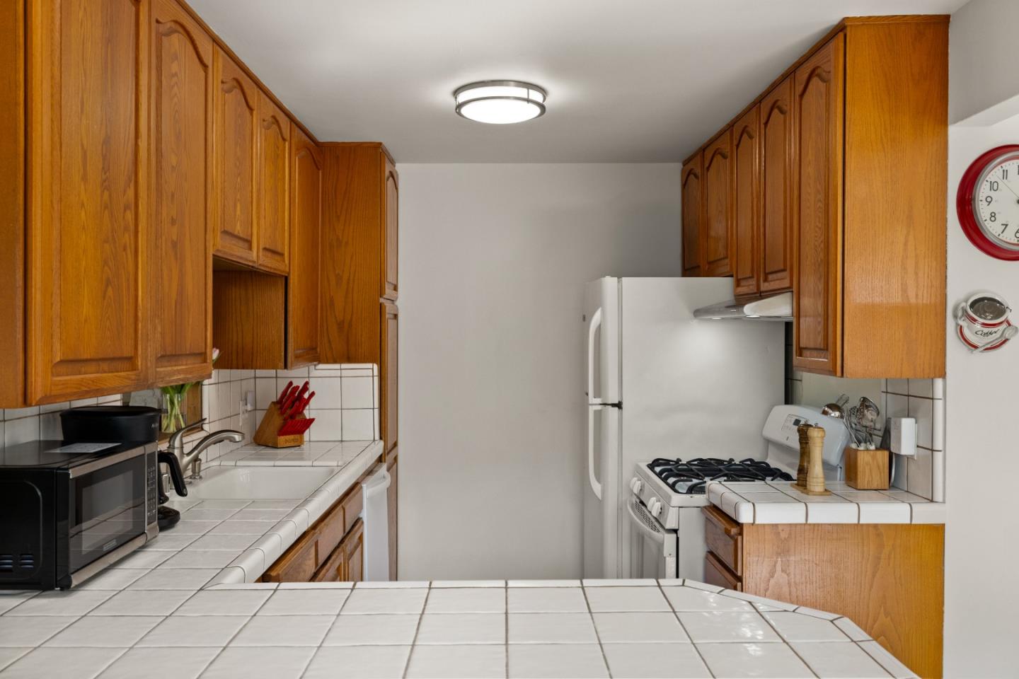 748 Alice Street Monterey, CA 93940 - Photo 13 of 36 a kitchen with stainless steel appliances a stove a sink and a refrigerator