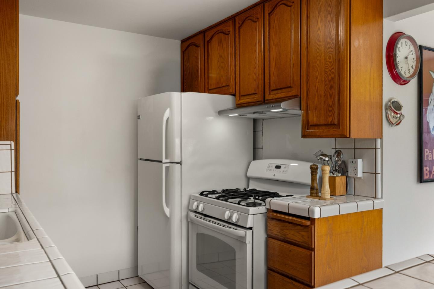 748 Alice Street Monterey, CA 93940 - Photo 14 of 36 a kitchen with stainless steel appliances granite countertop a refrigerator and a stove top oven