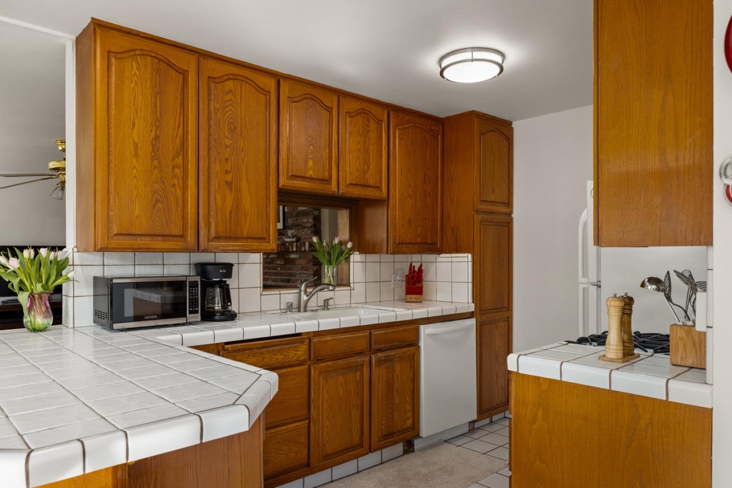 748 Alice Street Monterey, CA 93940 - Photo 15 of 36 a kitchen with a sink a stove and cabinets