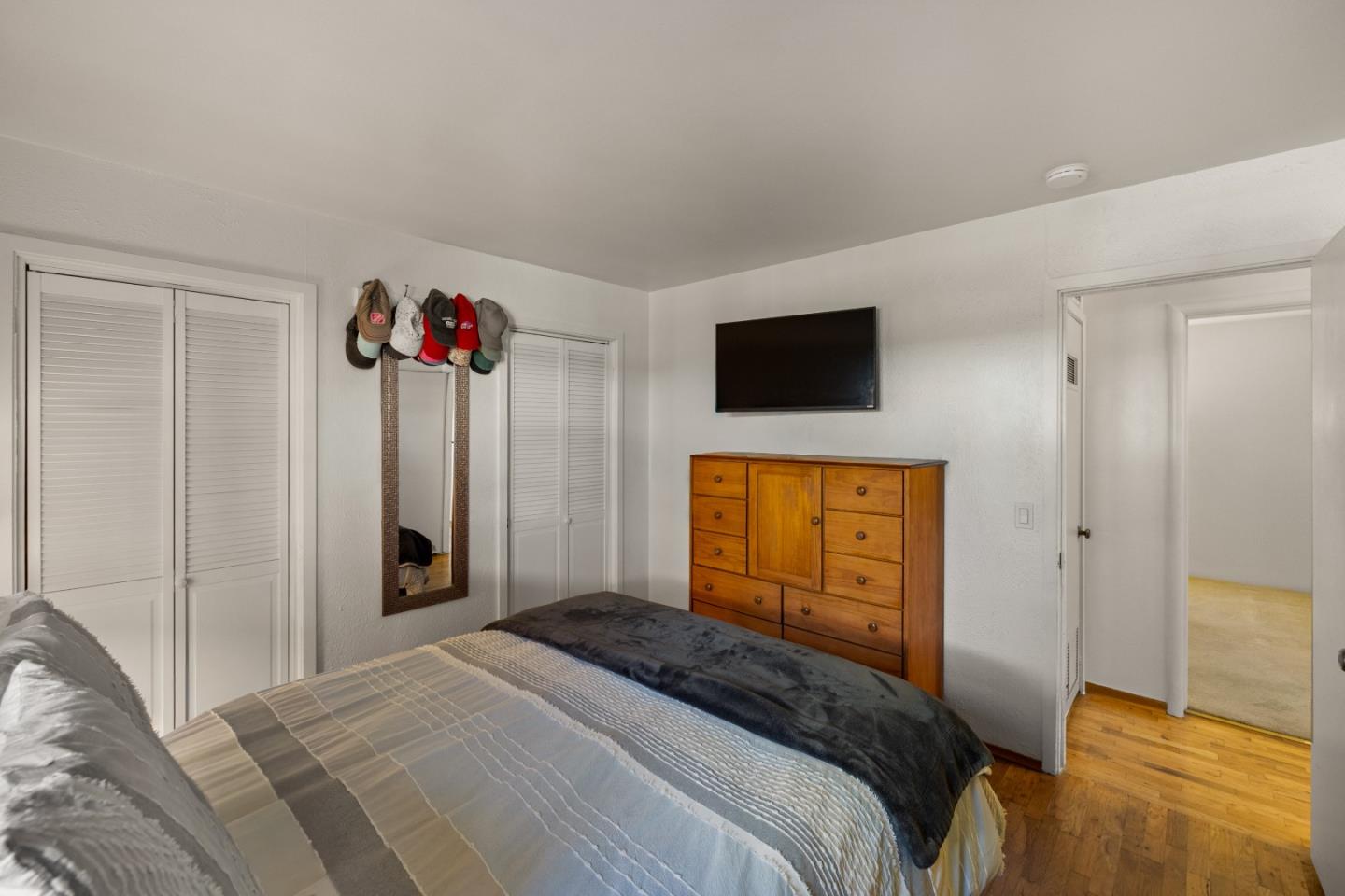 748 Alice Street Monterey, CA 93940 - Photo 19 of 36 a bedroom with a bed and a flat screen tv