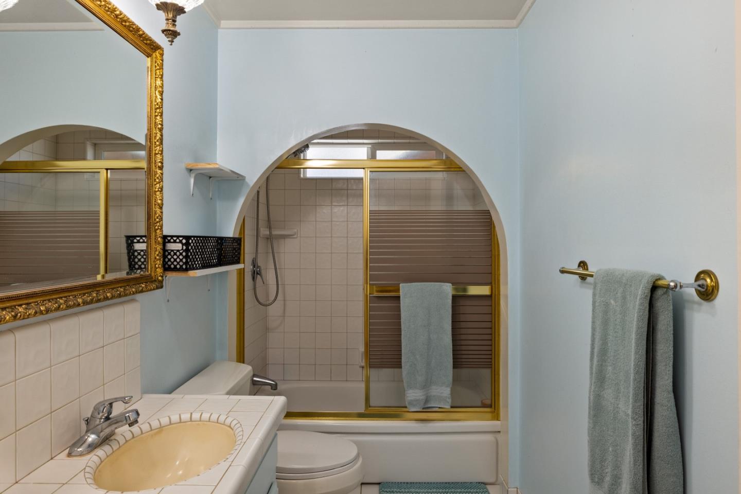 748 Alice Street Monterey, CA 93940 - Photo 20 of 36 a bathroom with a granite countertop toilet sink and mirror