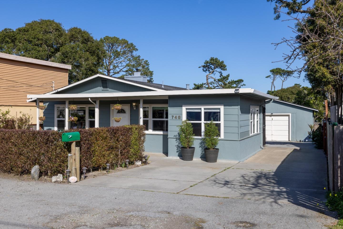 748 Alice Street Monterey, CA 93940 - Photo 2 of 36 a front view of a house with garden