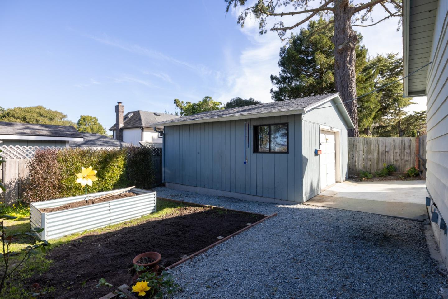 748 Alice Street Monterey, CA 93940 - Photo 31 of 36 a view of a backyard with a garden