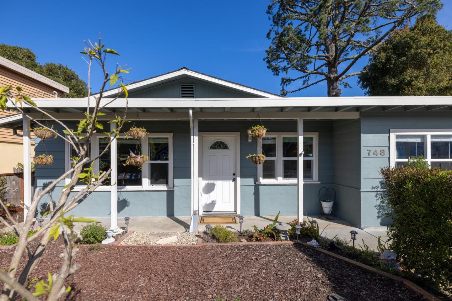 748 Alice Street Monterey, CA 93940 - Photo 33 of 36 a front view of a house with a yard
