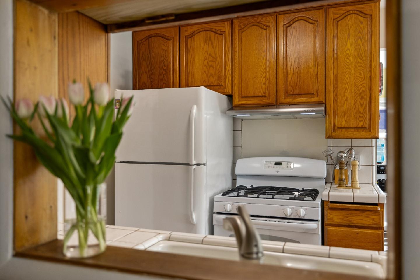 748 Alice Street Monterey, CA 93940 - Photo 9 of 36 a white refrigerator freezer sitting in a kitchen
