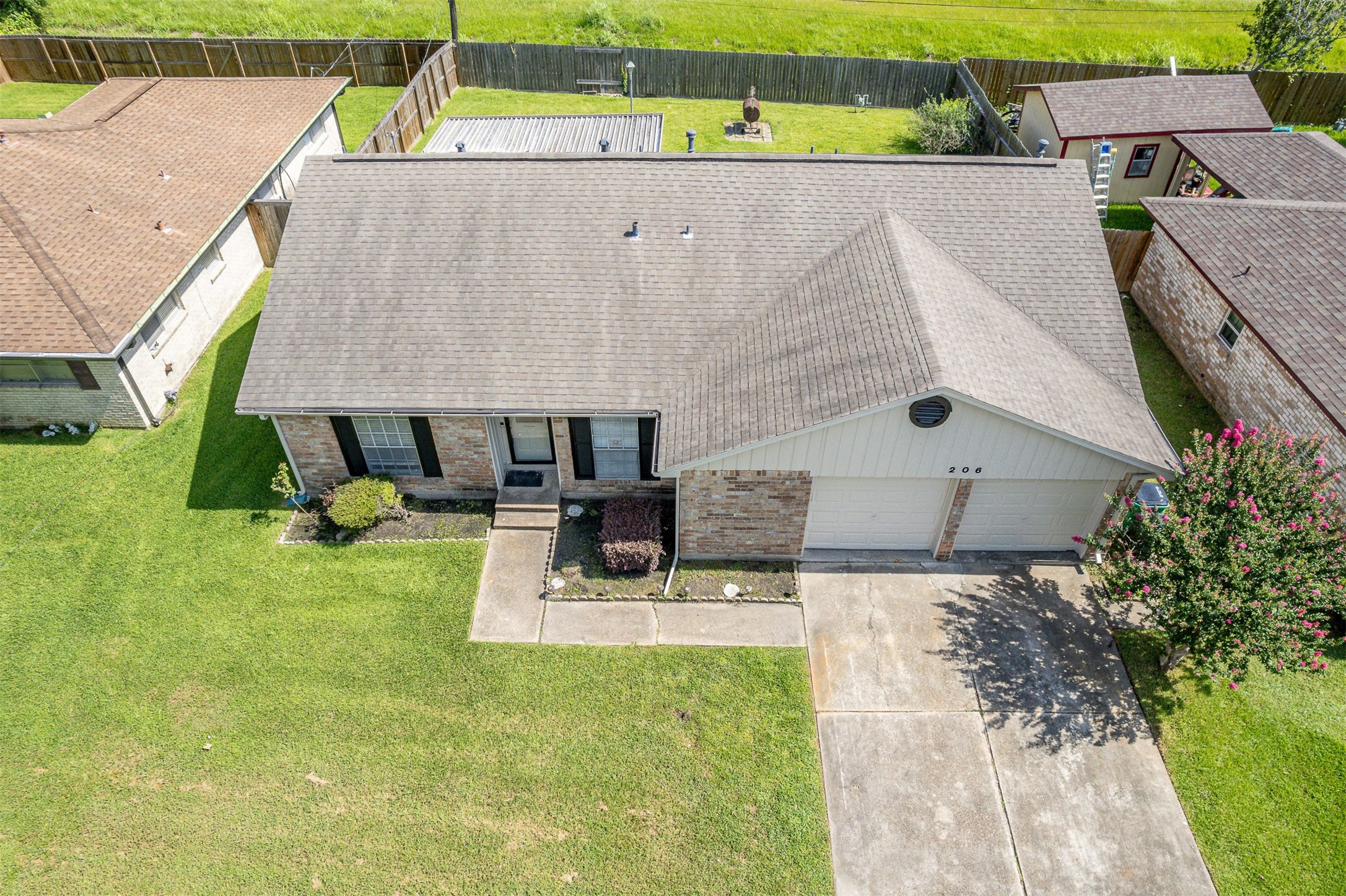 206 Kelly Lane Baytown, TX 77521 - Photo 8 of 38 The roof is approximately 5 years old.