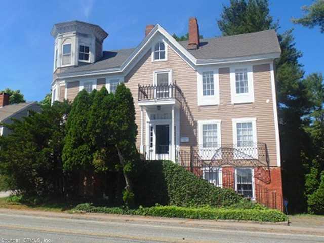 24 Main Street Stonington, CT 06378 - Photo 1 of 1 a front view of a house with a yard