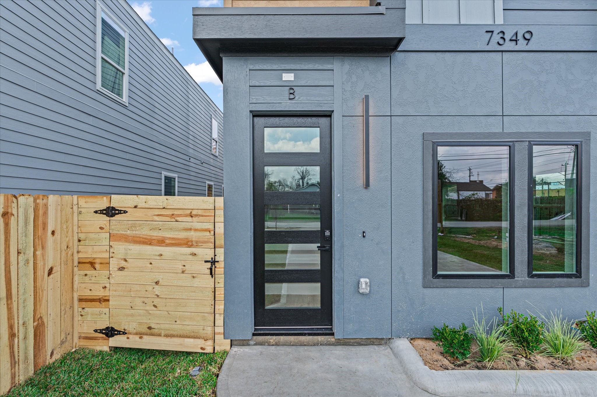 7349 Sandle Street, Unit B Houston, TX 77088 - Photo 1 of 19 front view of a house and a window
