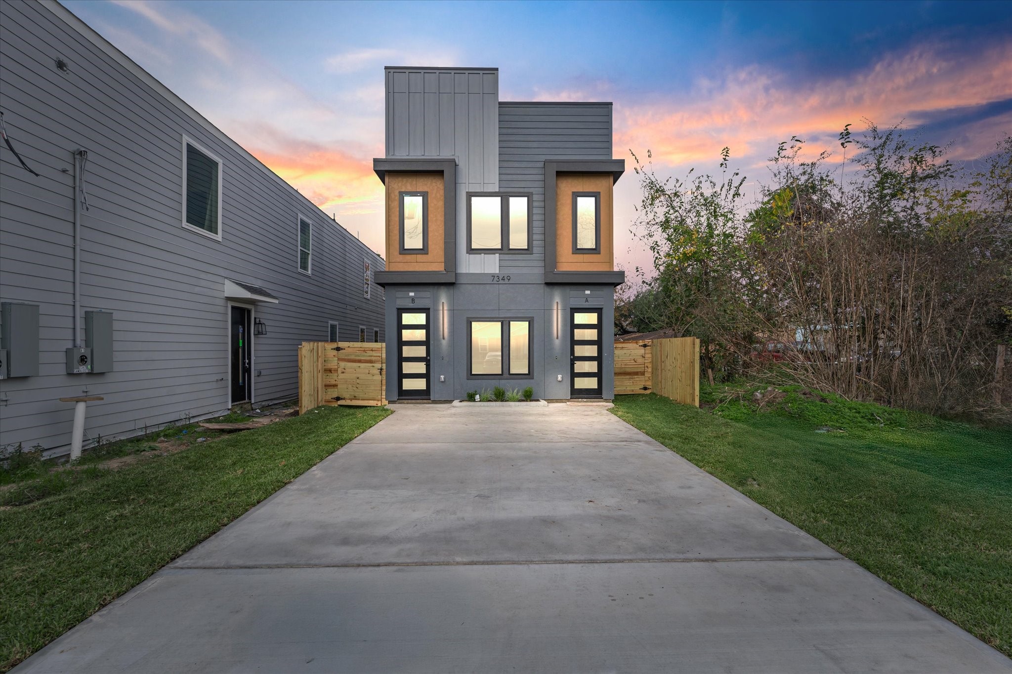 7349 Sandle Street, Unit B Houston, TX 77088 - Photo 18 of 19 a front view of a house with a yard and a yard
