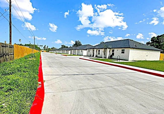 a view of swimming pool with an outdoor seating