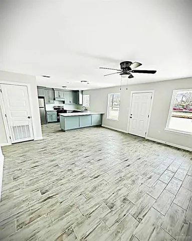 a view of a kitchen with electric appliances