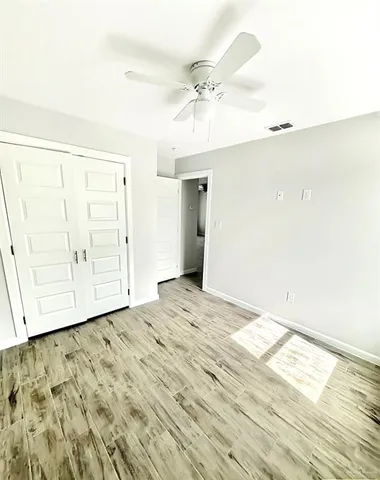 a kitchen with wooden cabinets and white appliances
