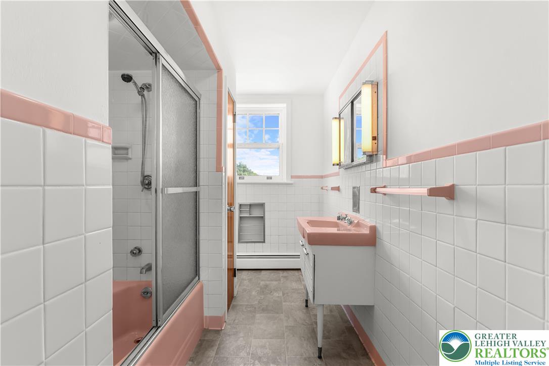 1512 West Broad Street Bethlehem, PA 18018 - Photo 19 of 50 a bathroom with a sink a toilet and shower