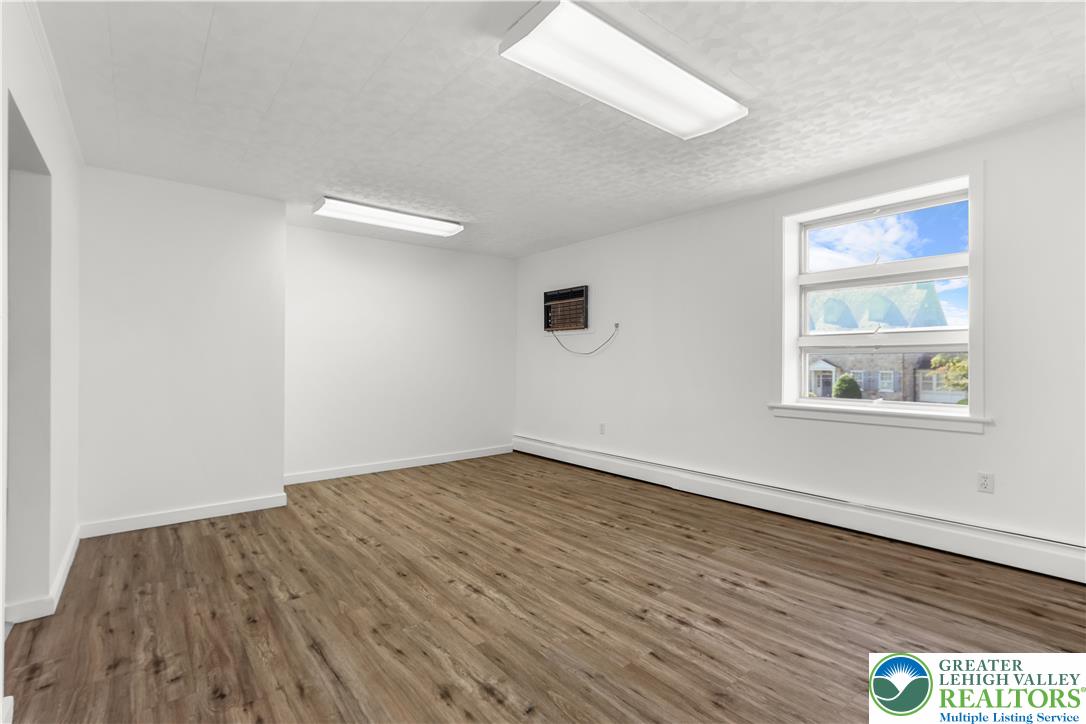 1512 West Broad Street Bethlehem, PA 18018 - Photo 20 of 50 an empty room with wooden floor and windows