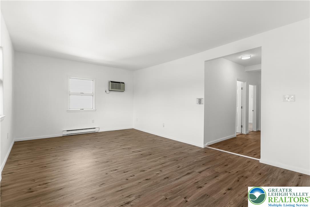 1512 West Broad Street Bethlehem, PA 18018 - Photo 21 of 50 an empty room with wooden floor and windows