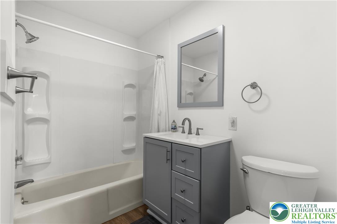 1512 West Broad Street Bethlehem, PA 18018 - Photo 27 of 50 a bathroom with a granite countertop sink a toilet and shower