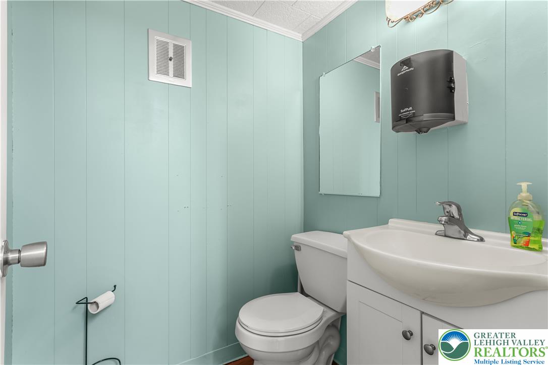 1512 West Broad Street Bethlehem, PA 18018 - Photo 37 of 50 a bathroom with a toilet sink and mirror