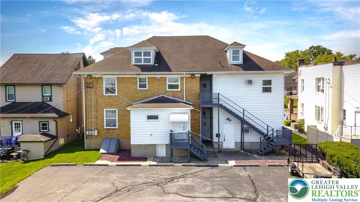 1512 West Broad Street Bethlehem, PA 18018 - Photo 47 of 50 a front view of a house with a yard and garage