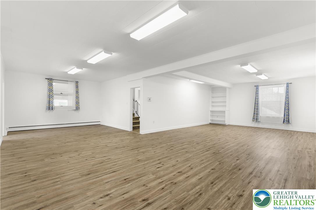 1512 West Broad Street Bethlehem, PA 18018 - Photo 9 of 50 an empty room with wooden floor and windows