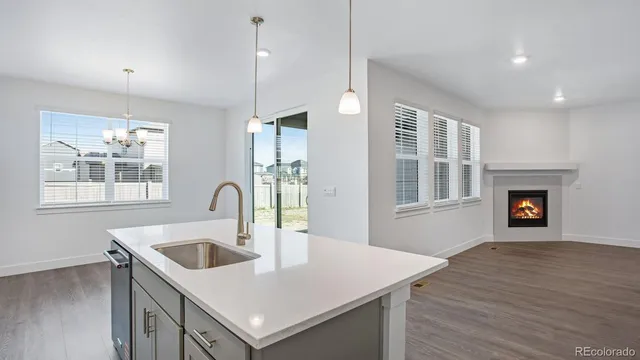 a kitchen with a sink a counter space and a window