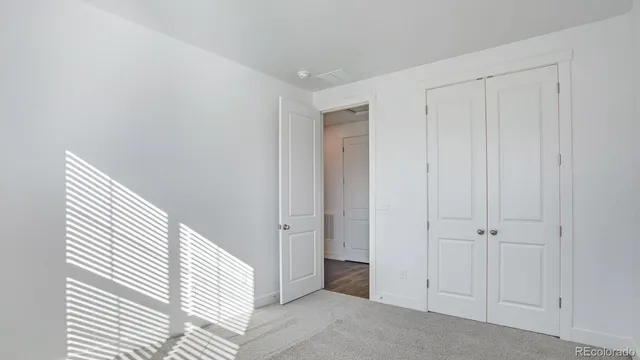 a view of a hallway with closet