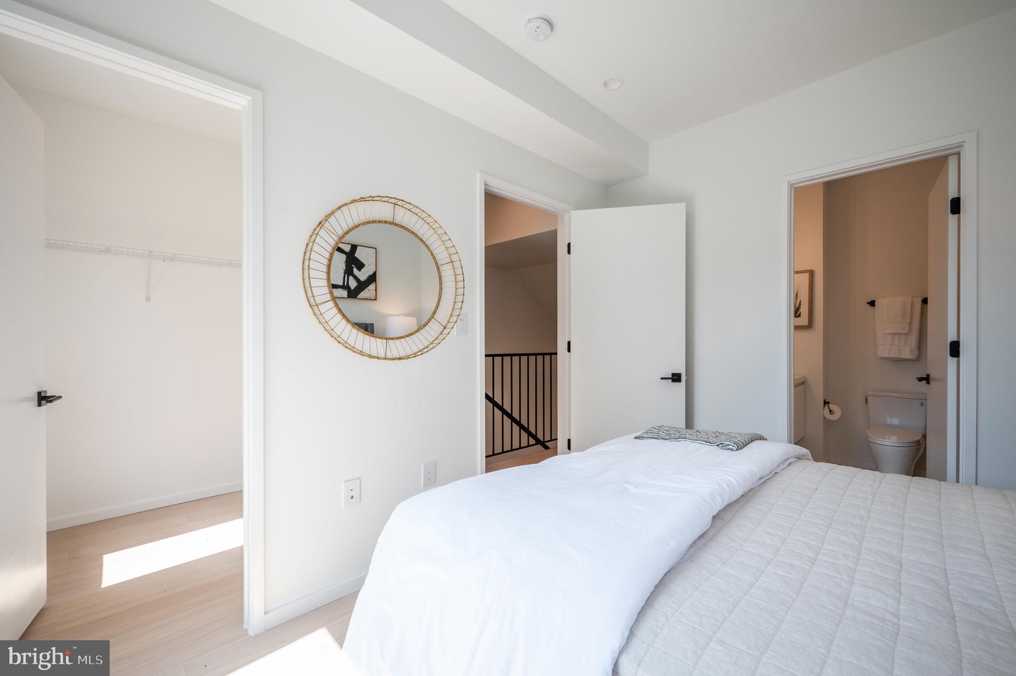 424 M Street Northwest, Unit 8 Washington, DC 20001 - Photo 14 of 27 a bedroom with a bed and a mirror
