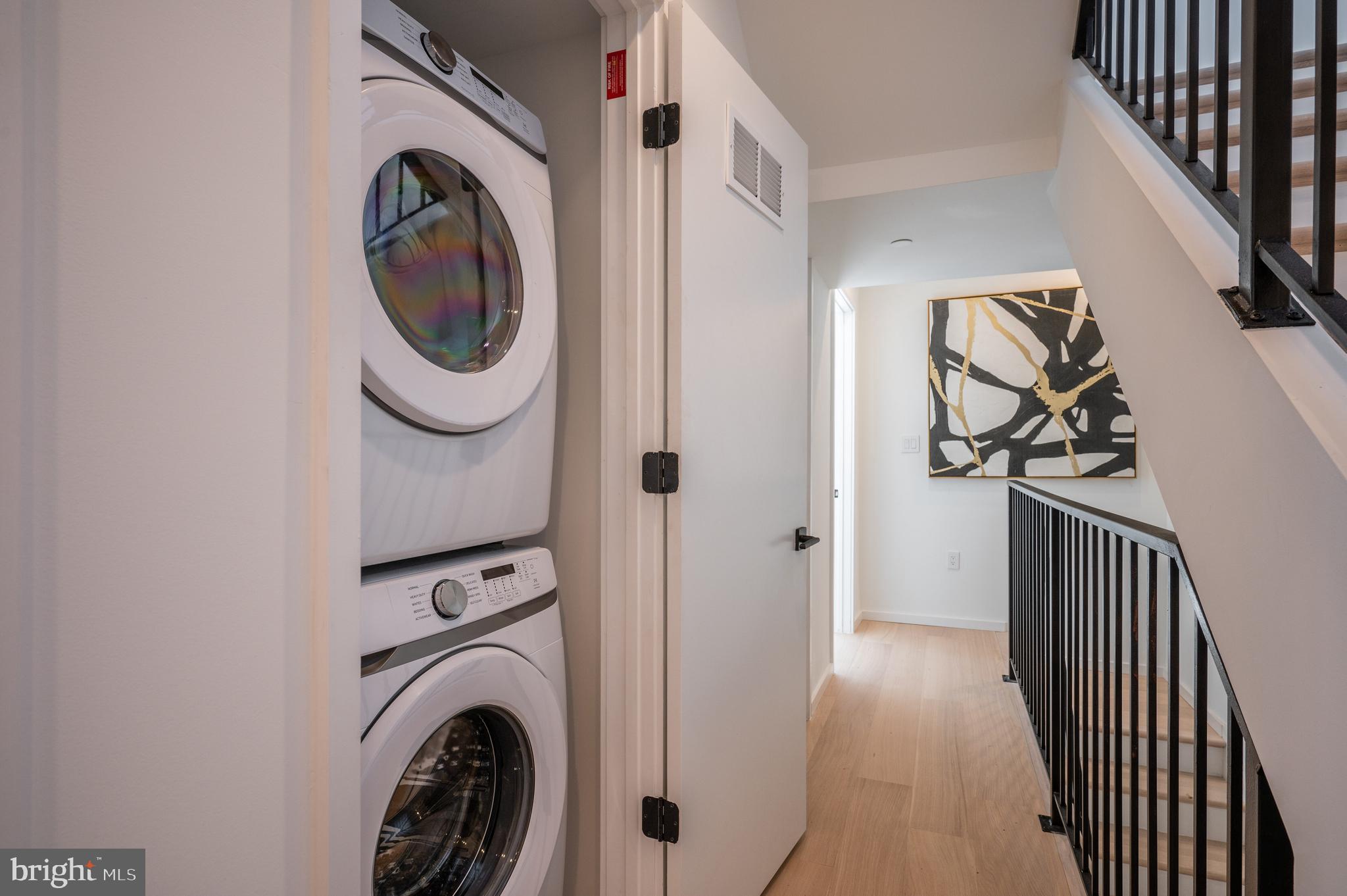 424 M Street Northwest, Unit 8 Washington, DC 20001 - Photo 17 of 27 a view of a hallway with washer and dryer