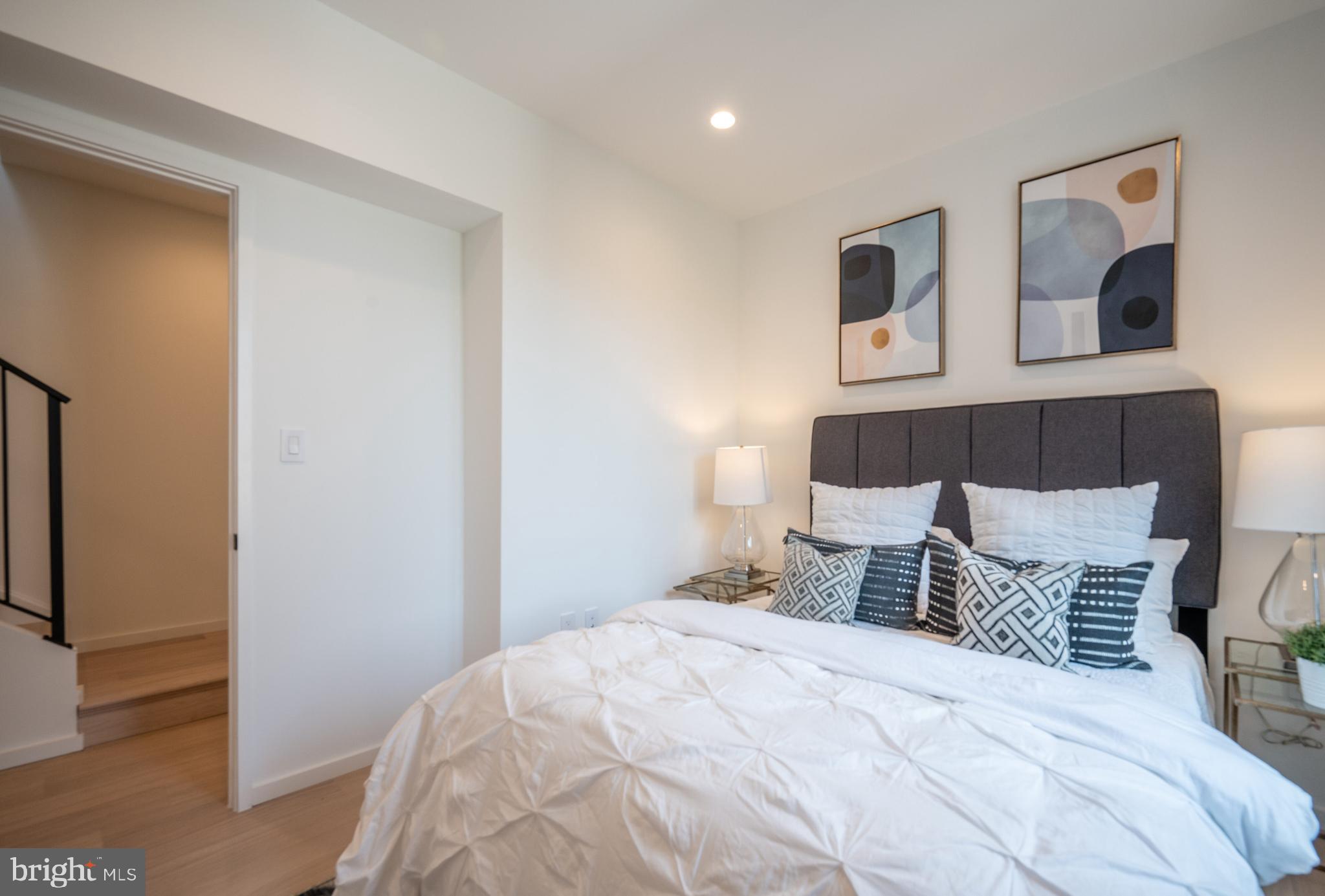 424 M Street Northwest, Unit 8 Washington, DC 20001 - Photo 20 of 27 a bedroom with a bed and wooden floor
