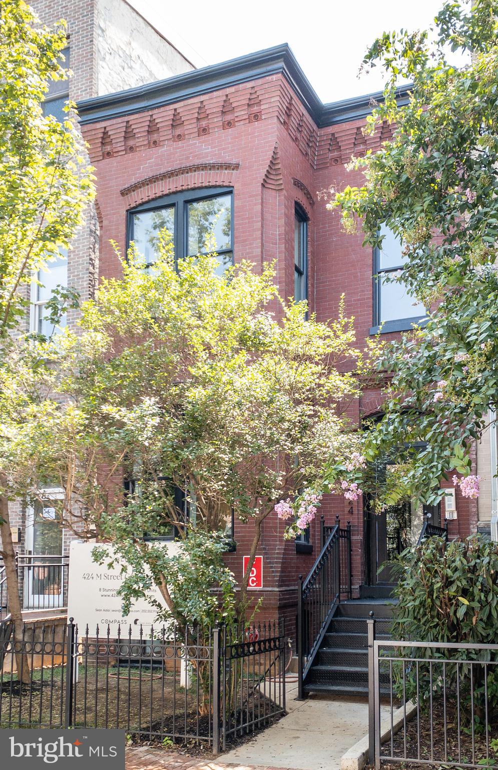 424 M Street Northwest, Unit 8 Washington, DC 20001 - Photo 2 of 27 a front view of a house with a yard