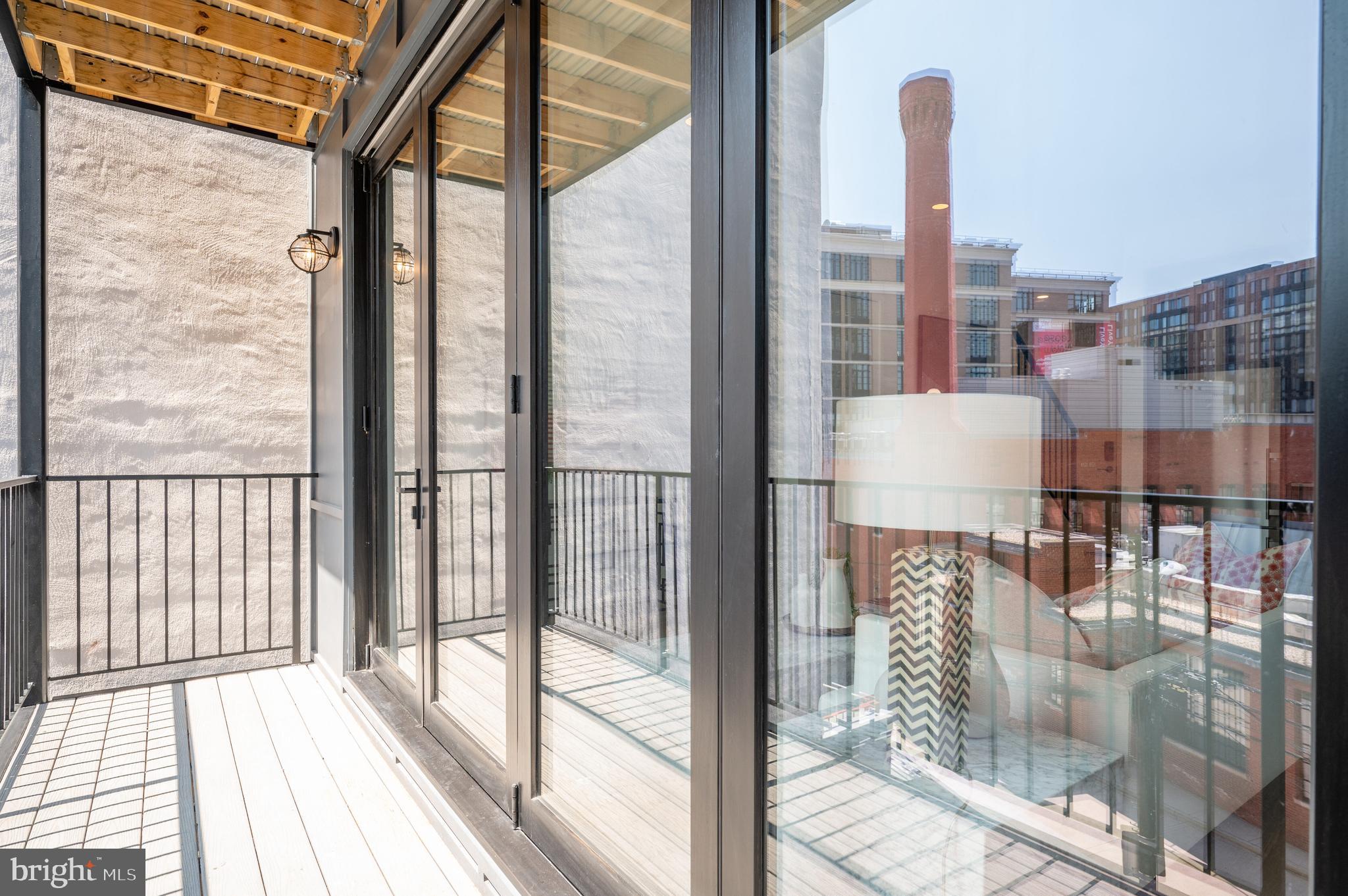 424 M Street Northwest, Unit 8 Washington, DC 20001 - Photo 5 of 27 a view of balcony with a glass door