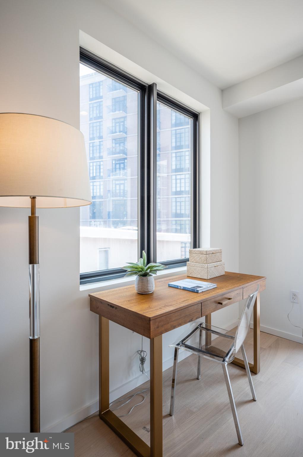 424 M Street Northwest, Unit 8 Washington, DC 20001 - Photo 7 of 27 a view of a room that has a table and chairs in it