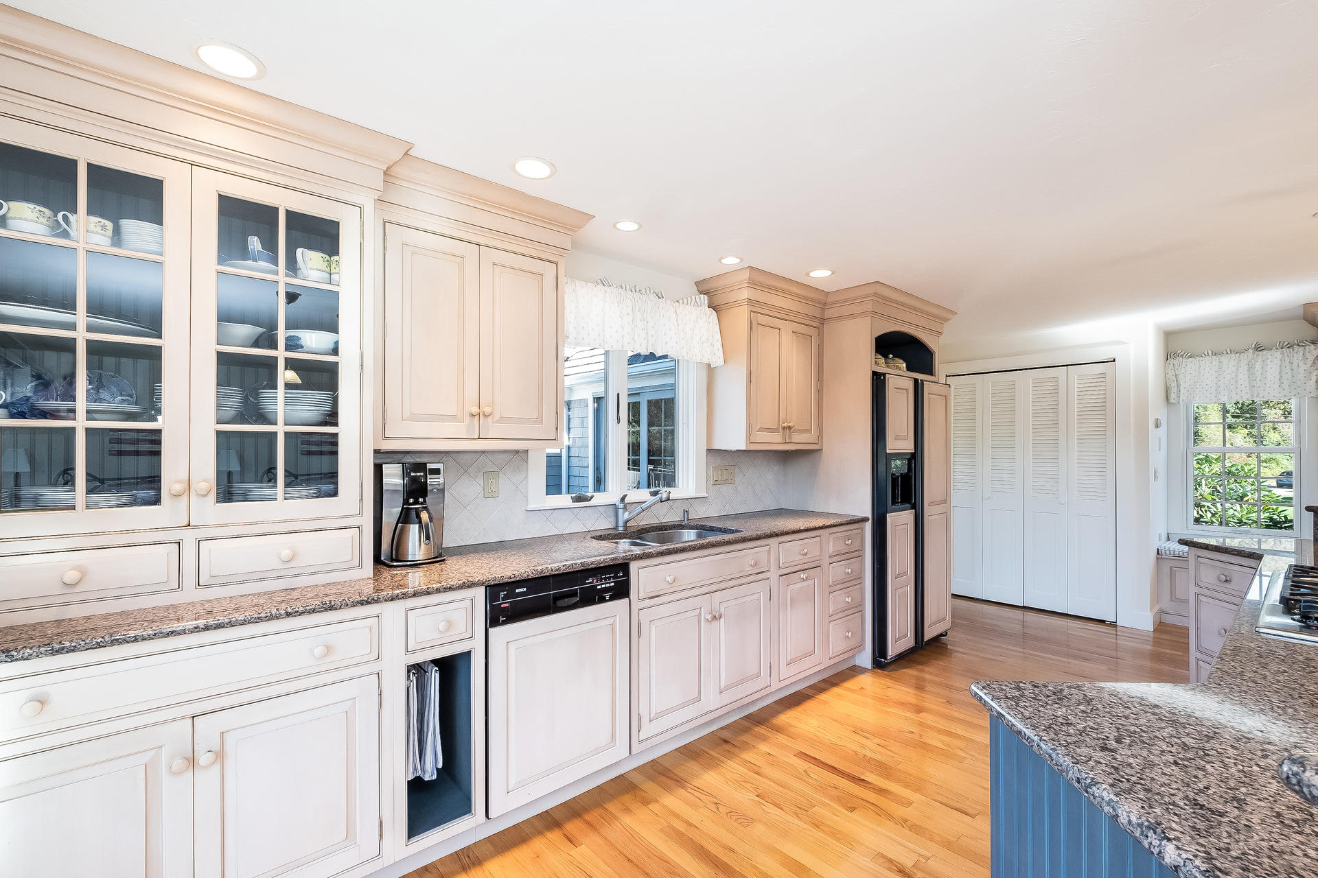 59 Bay Lane Centerville, MA 02632 - Photo 11 of 35 a large kitchen with granite countertop a sink stainless steel appliances and cabinets