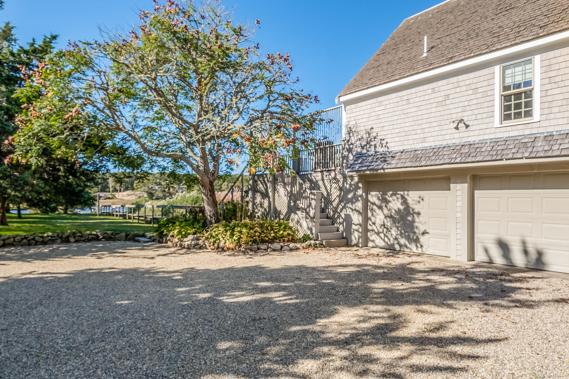 59 Bay Lane Centerville, MA 02632 - Photo 25 of 35 a view of a backyard with large trees