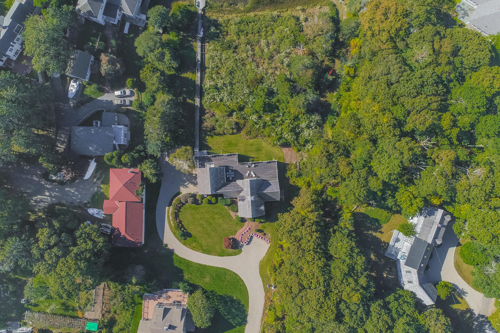 59 Bay Lane Centerville, MA 02632 - Photo 30 of 35 an aerial view of a house with a yard and large trees