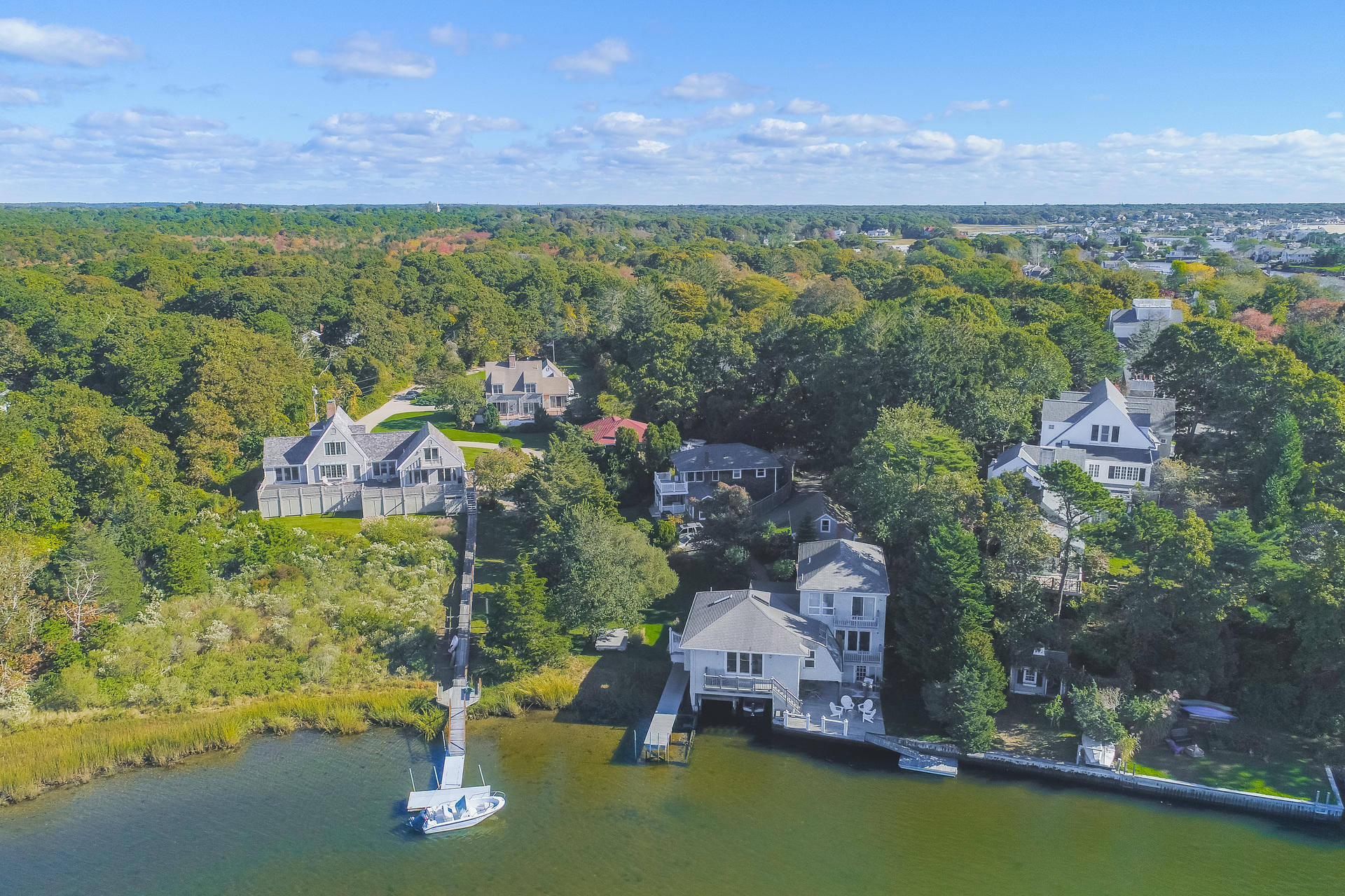 59 Bay Lane Centerville, MA 02632 - Photo 31 of 35 a view of a city with a lake in the background