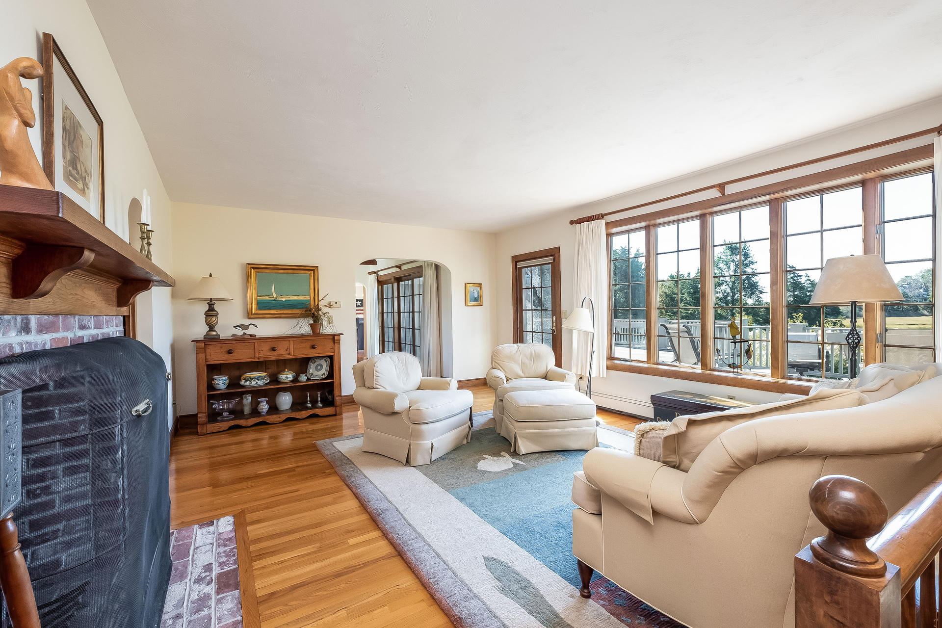 59 Bay Lane Centerville, MA 02632 - Photo 6 of 35 a living room with furniture large fireplace and wooden floor