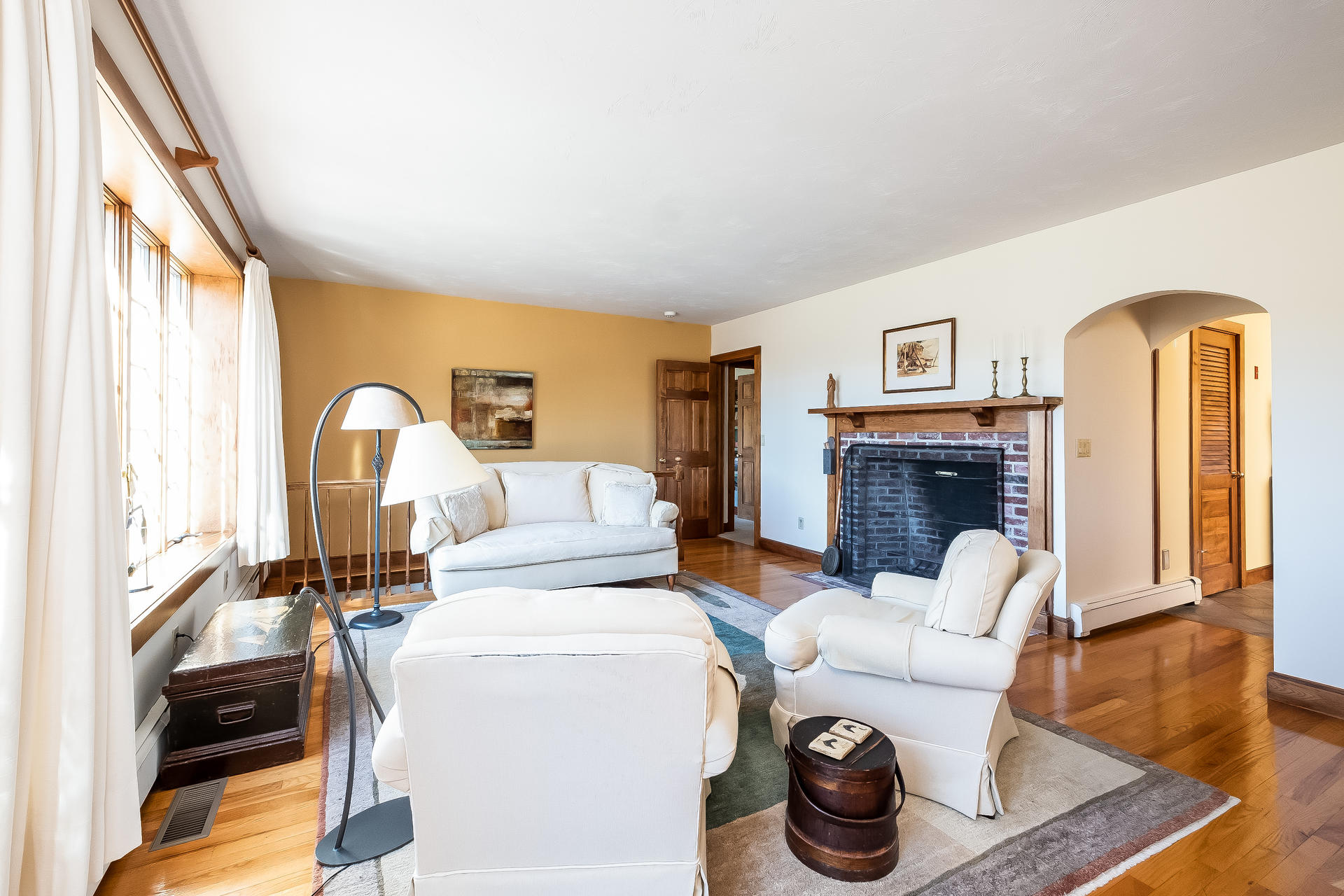 59 Bay Lane Centerville, MA 02632 - Photo 7 of 35 a living room with furniture a fireplace and a large window