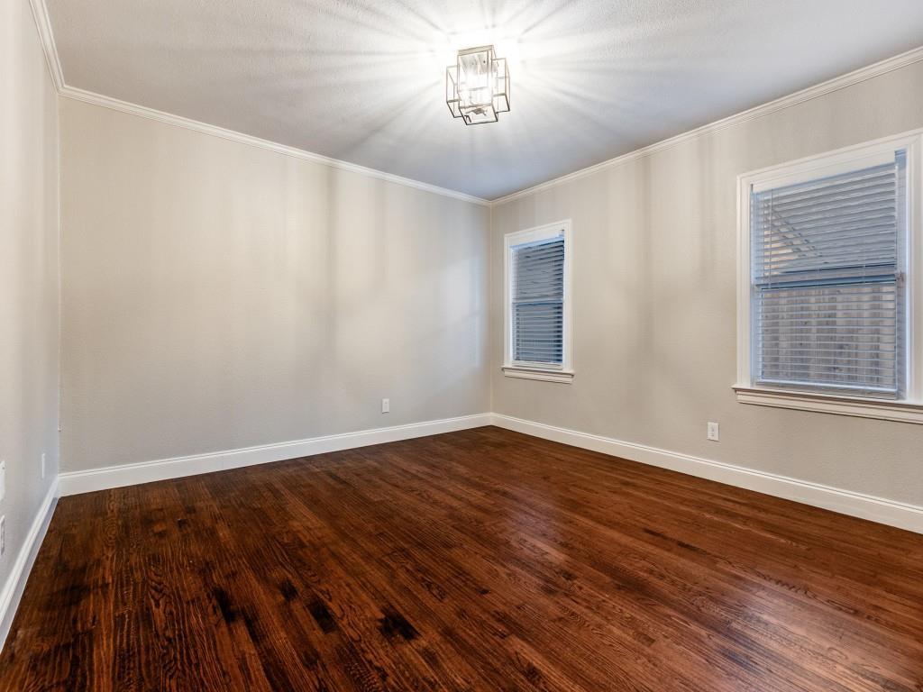 5514 Monticello Avenue Dallas, TX 75206 - Photo 14 of 20 a view of an empty room with wooden floor and a window