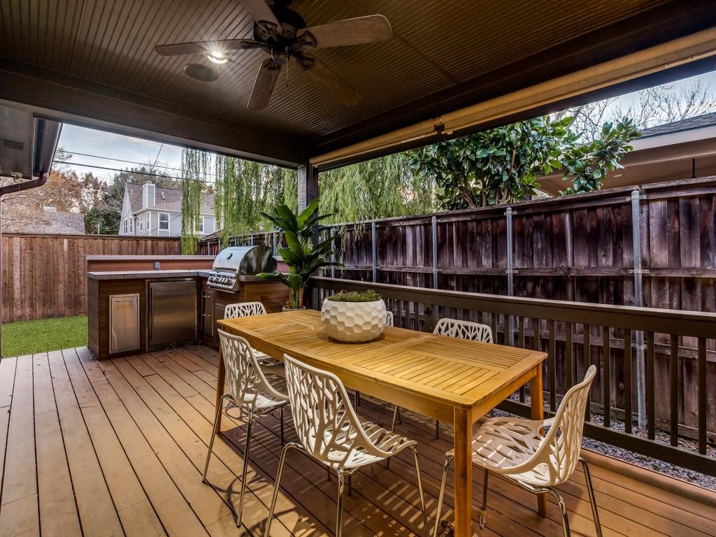 5514 Monticello Avenue Dallas, TX 75206 - Photo 16 of 20 a view of a patio with a table chairs and a backyard